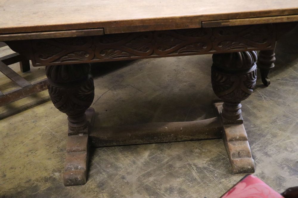 An Elizabethan style oak draw leaf extending dining table, 210cm extended width 80cm height 75cm - Image 3 of 3