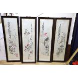 A set of four Chinese embroidered silk pictures worked with birds on flowering branches, each with
