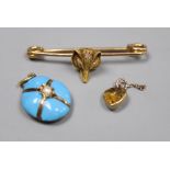 A Victorian yellow metal, turquoise and seed pearl set mourning pendant, 19mm, a yellow metal fox