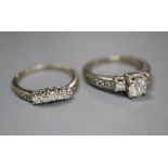 A modern 14k and diamond set engagement ring set, comprising single stone with diamond set shoulders