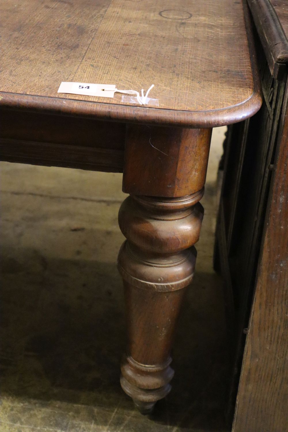 A Victorian oak extending dining table, 185cm extended (one spare leaf), width 120cm height 72cm - Image 2 of 4