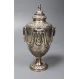 A George V silver vase and cover, with ram's head and swag decoration and two ring handles,