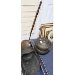 A Danish oxidised tin punch bowl, a Victorian copper coal helmet and a Victorian copper warming