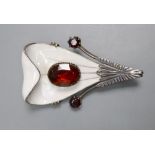 A Scandinavian? parcel gilt white metal, enamel and garnet set stylised leaf brooch, 56mm, gross