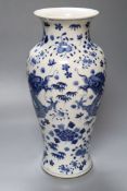 A Chinese porcelain baluster vase, painted with dragons and foliage, height 37cmCONDITION: Good