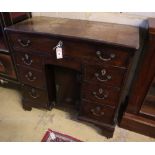 A George III walnut kneehole desk, width 90cm, depth 42cm, height 86cmCONDITION: The top is severely