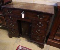 A George III walnut kneehole desk, width 90cm, depth 42cm, height 86cmCONDITION: The top is severely