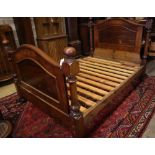 A Victorian mahogany three quarter size head and foot bedstead, width 137cm