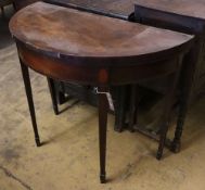 A George III mahogany 'D' shape folding tea table, width 91cm depth 45cm height 75cm