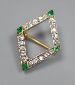 An early 20th century French yellow metal(18ct poincon mark), emerald and diamond set diamond shaped