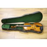 An early 20th century Czechoslovakian 3/4 size violin, bears fake Stradivarius label, cased