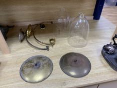 A pair of glass and brass hurricane lamps