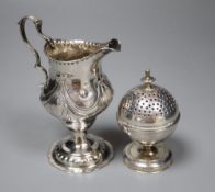 A George III silver inverted pear shaped cream jug, London, 1779 and a George III silver globe