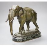 After Barye. A patinated bronze of an elephant on marble plinth, height 31cm