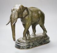 After Barye. A patinated bronze of an elephant on marble plinth, height 31cm