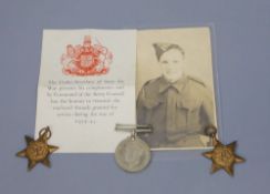 A WWII trio with photograph, the issue box addressed to Mr W. Brundson, nr. Bridgend