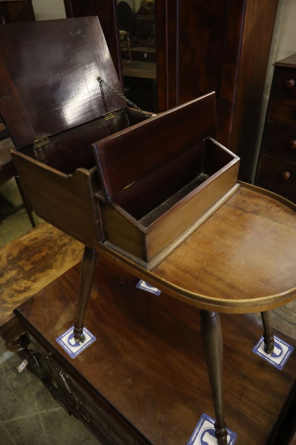 A Victorian mahogany sewing table on slender splayed baluster legs with brass caps and castors, - Image 2 of 3