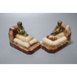 A pair of 1930's stepped marble book-ends, with seated youth surmounts, height 10cmCONDITION: Marble