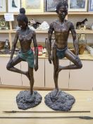 A pair of South African bronze figures, height 95cm