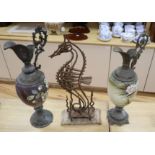 A wrought iron sea horse sculpture, 58cm and two spelter and enamelled glass ewers, 56cmCONDITION: