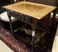 A 17th century and later carved oak side table with spiral-twist supports, width 86cm depth 59cm