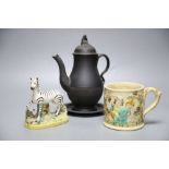 A 19th century Staffordshire pottery model of a zebra, a Victorian relief-moulded frog mug, a