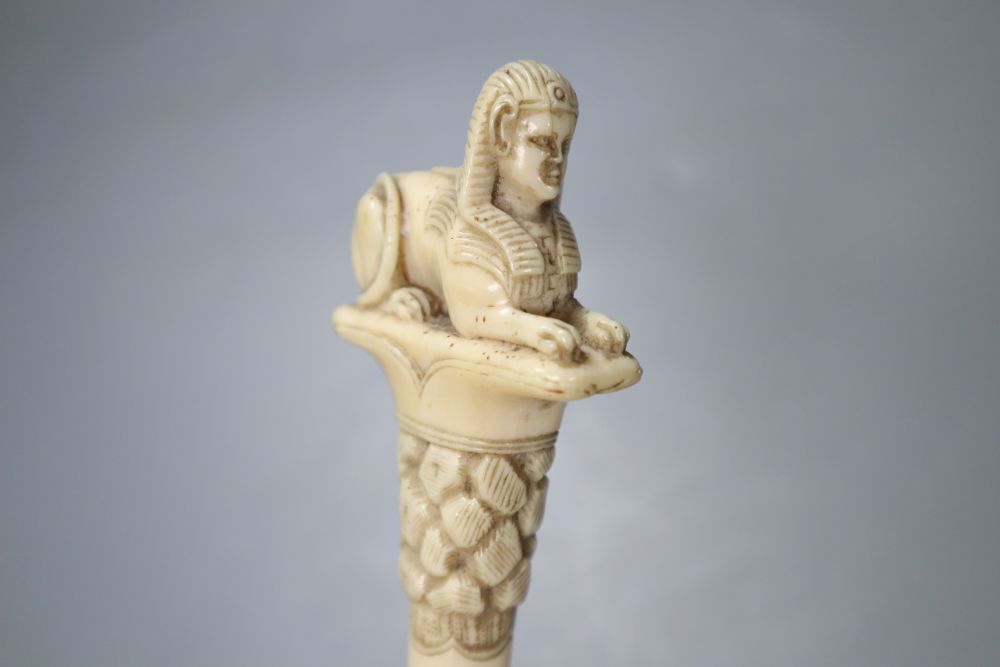 An early 20th century ivory sphinx parasol handle, 84cm - Image 2 of 4