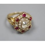 A Victorian style yellow metal ruby and diamond oval cluster ring, with central rectangular