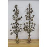 A pair of tall brass candelabra