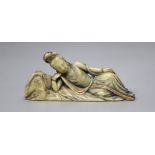 An 18th century Chinese painted soapstone reclining Guanyin, height 12cm
