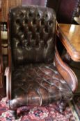 A Victorian mahogany library chair, upholstered in buttoned brown leather, width 64cm height 90cm