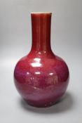 A Chinese porcelain bottle vase, Sang de boeuf glaze, height 34cmCONDITION: Sang de boeuf vase