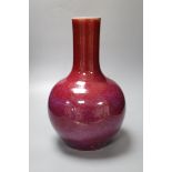 A Chinese porcelain bottle vase, Sang de boeuf glaze, height 34cmCONDITION: Sang de boeuf vase