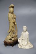 A 19th century Chinese carved soapstone model of Guanyin and a Kangxi Dehua figure of Guanyin (the