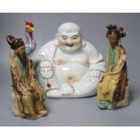 Four Chinese ceramic figures including Budai, 23cm, an enamelled phoenix, 24cm and two Chinese