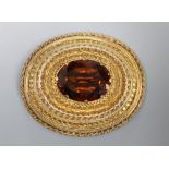 A Victorian yellow metal and citrine set oval brooch, with cannetile work decoration, 41mm, gross