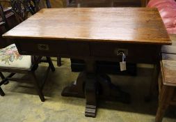 A Gothic style pitch pine two drawer side table, width 100cm depth 55cm height 83cm