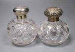 A Victorian silver mounted cut glass scent bottle, 12cm and an Edwardian silver mounted cut glass