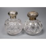 A Victorian silver mounted cut glass scent bottle, 12cm and an Edwardian silver mounted cut glass