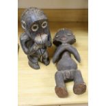 Two Mabila wood figures, one with 'peg' hair, tallest 49cm