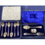 A cased Edwardian silver christening trio, Chester, 1908/09 and a cased set of six silver