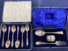 A cased Edwardian silver christening trio, Chester, 1908/09 and a cased set of six silver