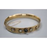 A 9ct and bronze core hinged bangle set with four diamonds and a cabochon stone.