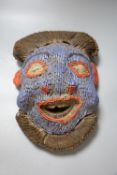 A Bamileke Kam Crest beadwork mask, Cameroon