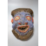 A Bamileke Kam Crest beadwork mask, Cameroon