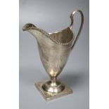 A George III engraved silver helmet shaped cream jug by Hester Bateman, London, 1785, 14.9cm, 4.5oz,