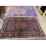 A Tabriz red and blue ground rug with pole medallion, 205 x 138 cm (worn) and a Fereghan rug with