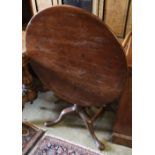 A George III mahogany tilt-top occasional table on tripod base (top repaired), diameter 77cm