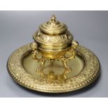 A brass desk stand, with hinged cover, diameter 24cm