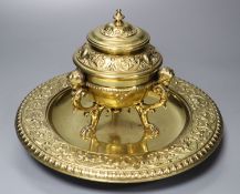 A brass desk stand, with hinged cover, diameter 24cm